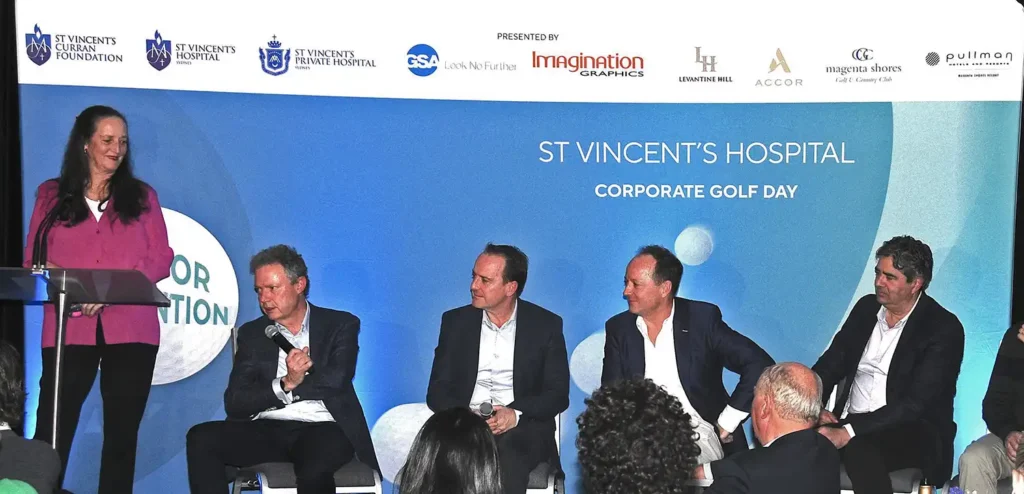 St Vincent' s Hospital Corporate Golf Day on stage with the media wall produced by Imagination Graphics